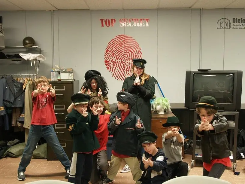 Children taking part in a spy camp activity