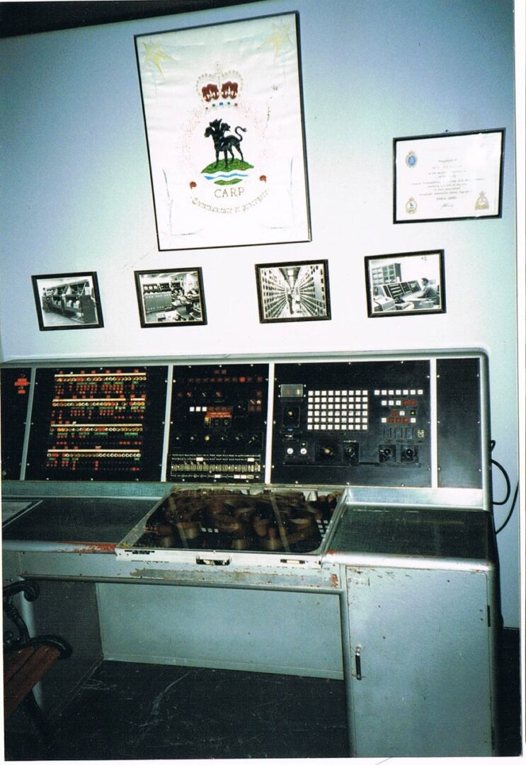 Vintage computer control panel with switches and buttons.