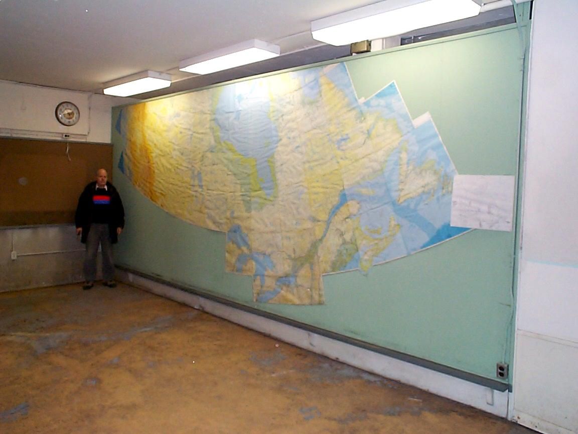Large detailed map of Canada displayed on a classroom wall.