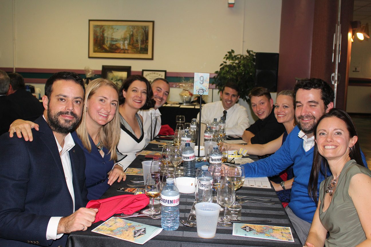 A group of friends enjoying a meal together at a restaurant.