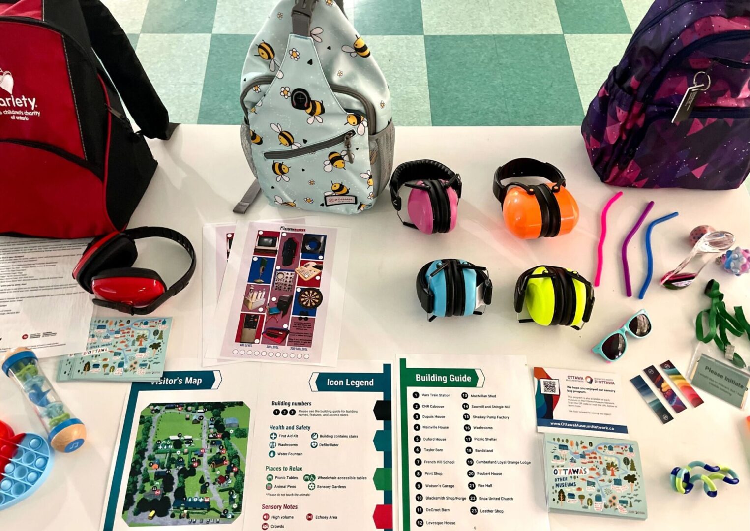 Board game setup with colorful headphones and character cards.