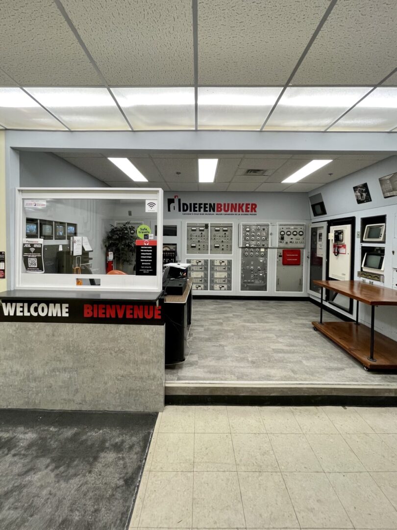 Modern, organized tattoo studio reception area with display cases and welcoming counter.