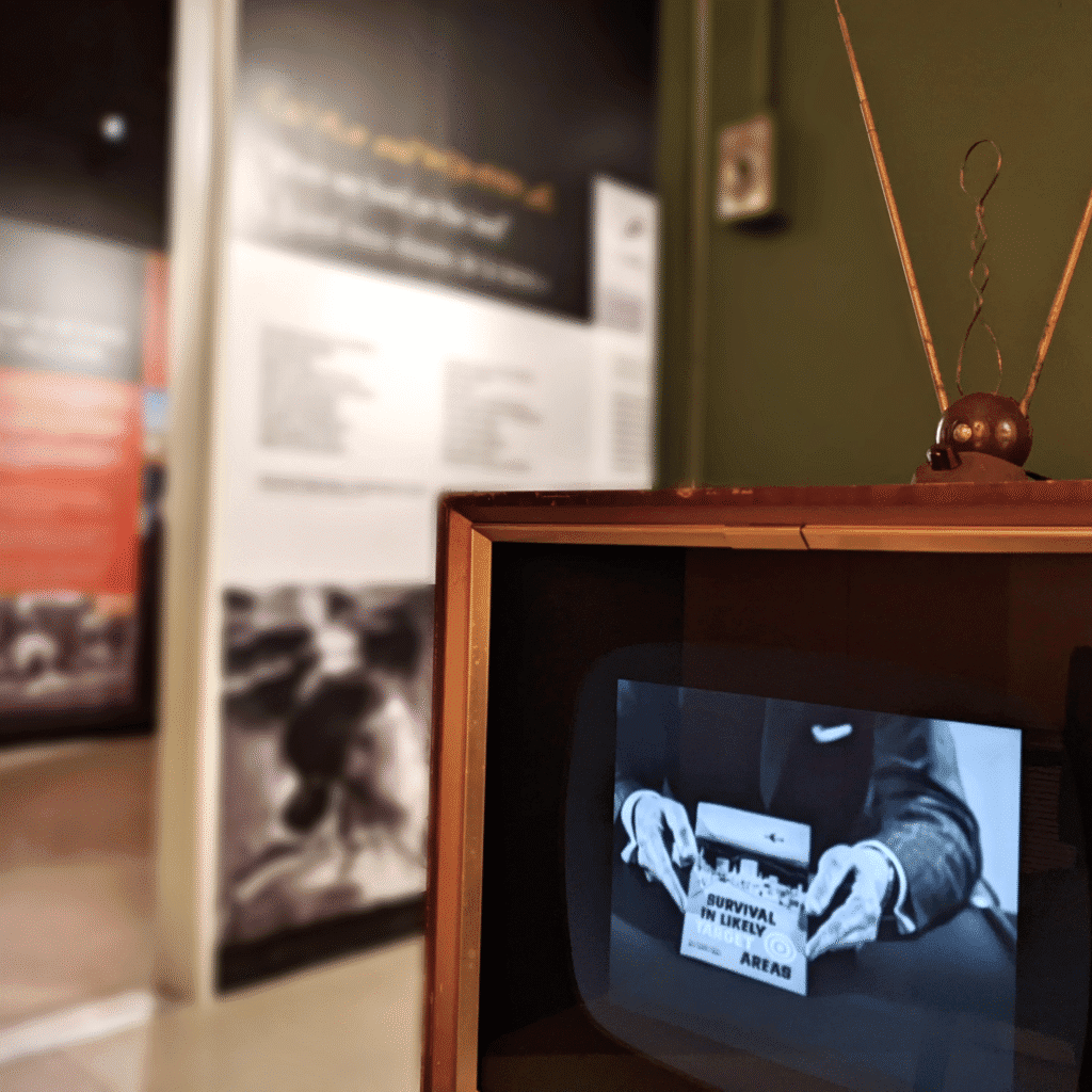 Retro television screen within an exhibition displaying Cold War advertisements.