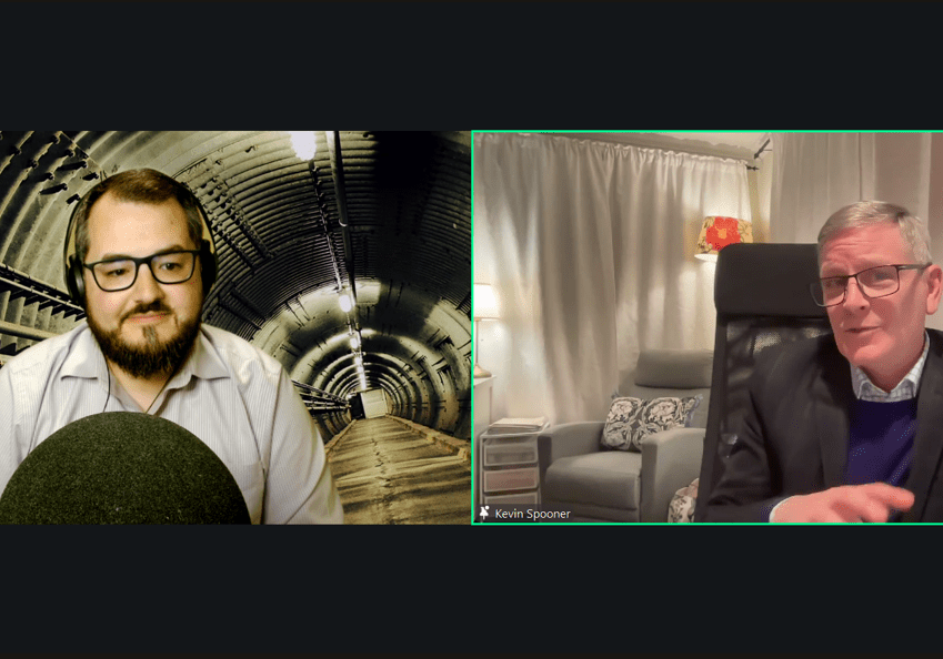Two men engaged in a virtual video call, each in their own room with distinct backdrops.
